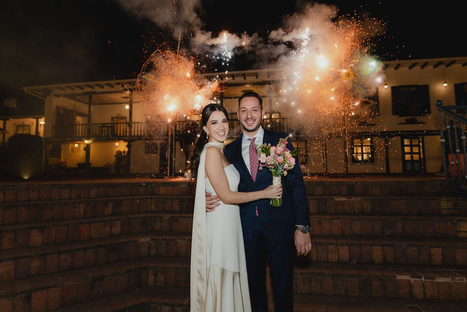 Couple celebrating their wedding in the gardens of Estancia Rosario.