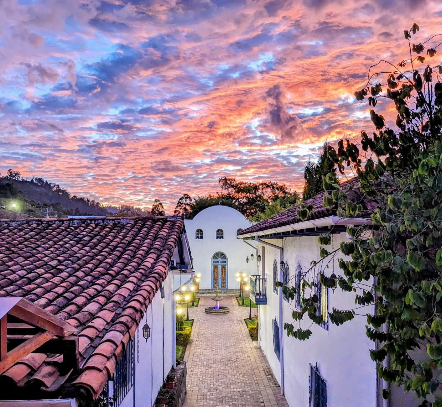 Historic courtyard and chapel of Estancia Rosario at sunset.